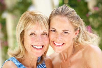 mother and daughter smiling