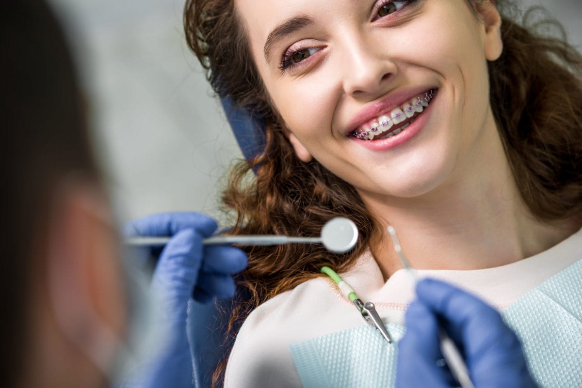 orthodontist with patient